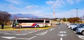 Parking car with bus and arrow sign on street or road to tell direction turn left, right or straight with digital TV tower Royalty Free Stock Photo