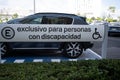 parking car space for person with disability, sign spelling in Spanish \
