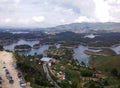 Parking with cars and tourists arriving at the Guatape lakes and the PeÃÂ±ol rock