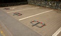 Parking for cars and wheelchairs with a mechanical latch on the lock. just erect a bollard and no one will park in the place. priv Royalty Free Stock Photo