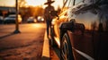 Parking in the city at sunset in Texas. Woman in hat charging electro car at the electric gas station