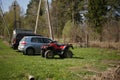 Parking at the cottage. Jeep , passenger car, quad bike, bicycles. Royalty Free Stock Photo