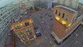 Parking in courtyard among buildings with