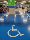 Parking for the disabled. The parking lot has a blue background and has a special logo.