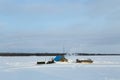 Parking fisherman on a snowy river.