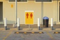 Parking in front of the bathroom in the gas station, signs, women, men Red yellow background.Man and Woman icons. Male and female Royalty Free Stock Photo