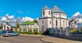 Parking in front of the entrance to the monastery grounds. With a church standing in the depths with domes and gold-cast Royalty Free Stock Photo