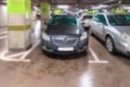 Parking garage blurred. Empty road asphalt background in soft focus. Car lot parking space in underground city garage. Modern Royalty Free Stock Photo