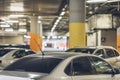 Parking garage, underground interior with parked cars. Defocused blurred background Royalty Free Stock Photo