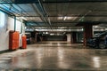 Parking Garage, Illuminated Underground Car Park Lots under modern Mall with Vehicles