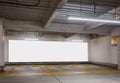 Parking garage underground with blank billboard Royalty Free Stock Photo