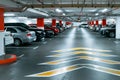 Parking garage underground interior background or texture. Concrete grunge wall and column with warning sign, industrial retro Royalty Free Stock Photo