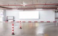 Parking garage underground interior with blank billboard. Royalty Free Stock Photo