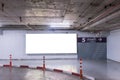 Parking garage underground interior with blank billboard. Royalty Free Stock Photo