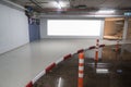 Parking garage underground interior with blank billboard.Empty space car park interior at afternoon Royalty Free Stock Photo