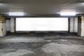 parking garage underground interior with blank billboard.Empty space car park interior at afternoon.Indoor parking lot.