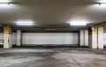 Parking garage underground interior with blank billboard.Empty space car park interior at afternoon.Indoor parking lot. Royalty Free Stock Photo