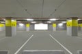 Parking garage underground interior with blank billboard. Royalty Free Stock Photo