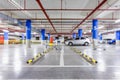 Parking garage, underground interior with a few parked cars Royalty Free Stock Photo