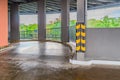 Parking garage, underground interior with a few parked cars. Neon light in bright industrial building. Royalty Free Stock Photo