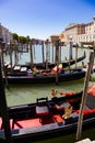 Parking gondolas on the pier in Grand Canal Royalty Free Stock Photo