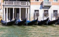 Parking gondolas on the pier in Grand Canal Royalty Free Stock Photo