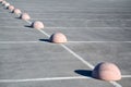 Parking hemispheres. Concrete parking limiter. Protection from car parking. Elements to restrict access to parking zone and Royalty Free Stock Photo