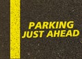 Parking just ahead written on the road. Royalty Free Stock Photo