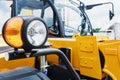 Parking lamp on a yellow tractor