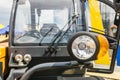 Parking lamp on a yellow tractor