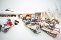 Parking a large number of snowmobiles at the tourist winter camp in nature.