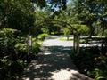 Parking lot and brick path and arch and shade