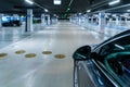 Parking lot. Car lot parking space in underground city garage. Empty road asphalt background. Ground floor for car parking Royalty Free Stock Photo