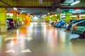 Parking lot cars blurred. Car lot parking space in underground city garage. Empty road asphalt background in soft focus Royalty Free Stock Photo