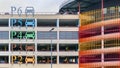 Parking lot with coloured decorations and building wall