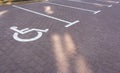 Parking lot for disabled. Parking sign wheelchair on the road. Parking space for disabled. Empty slot for car. Royalty Free Stock Photo