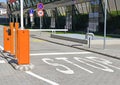 Parking lot gate and stop sign next to an office building Royalty Free Stock Photo