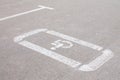 Parking lot with handicap sign and symbol. Empty reserved parking space with wheelchair symbol. Disabled person sign Royalty Free Stock Photo