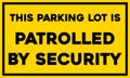 This parking lot is patrolled by security sign Royalty Free Stock Photo