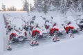 Parking lot for snowmobiles in the snow