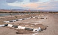 Parking lot spaces at rest area near main highway, desert landscape background Royalty Free Stock Photo