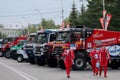 Row of rally trucks parked on the square during Silk way rally