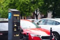 Parking meter on city street, space for text. Modern device Royalty Free Stock Photo