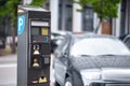 Parking meter on city street, space for text. Modern device Royalty Free Stock Photo