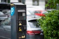 Parking meter on city street, space for text. Modern device Royalty Free Stock Photo