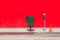 parking meter in front of red wall Royalty Free Stock Photo