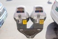 Parking meters along a street in a city centre Royalty Free Stock Photo