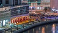 Parking near canal in Dubai at night, UAE aerial timelapse Royalty Free Stock Photo