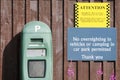 Parking pay machine and no overnight camping sign Royalty Free Stock Photo
