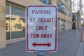 Parking By Permit Only Tow-Away sign with arrows in downtown Austin Texas Royalty Free Stock Photo